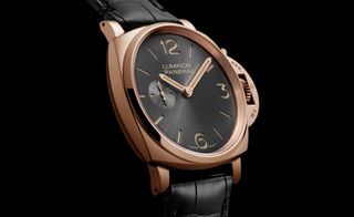 Panerai’s ’Due’ watch with a black face and gold hands and rim.