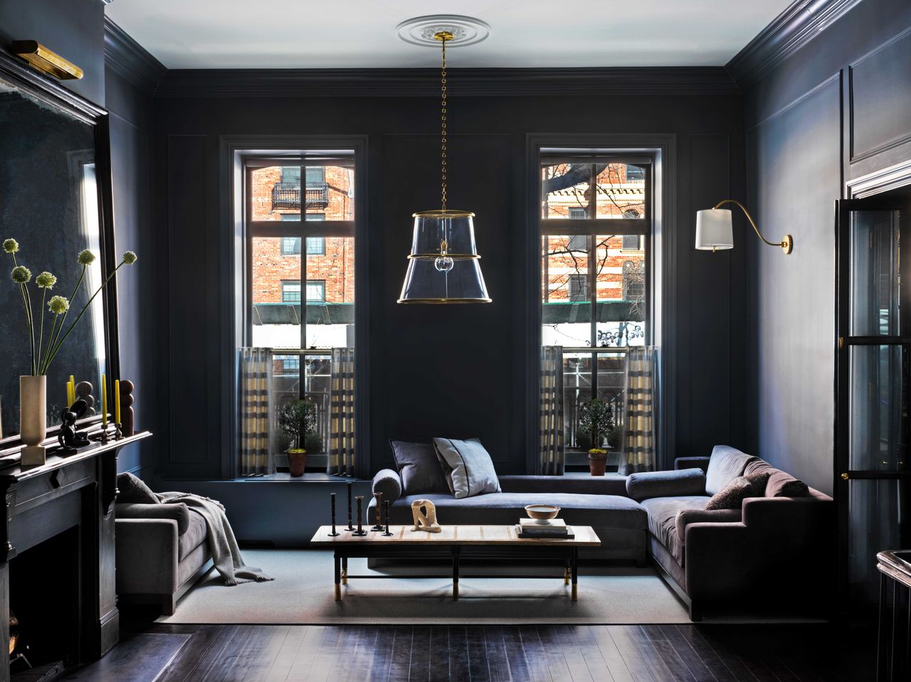 navy living room with white ceiling and ceiling medallion