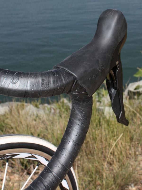 The newly concealed cables can be set either to the inboard or outboard side of the lever, though in either case there's a square edge placed right beneath your palm and more friction in the line than the old external routing.