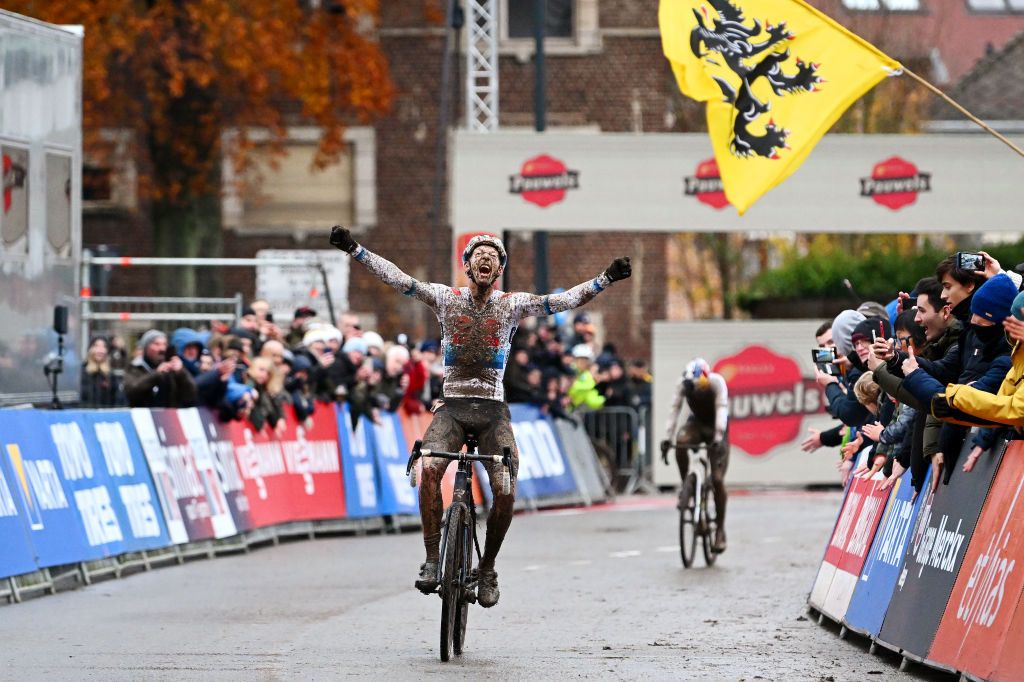 OVERIJSE BELGIUM NOVEMBER 20 Michael Vanthourenhout of Belgium and Team Pauwels Sauzen Bingoal celebrates at finish line as race winner ahead of Thomas Pidcock of United Kingdom and Team INEOS Grenadiers during the 62nd UCI Cyclocross World Cup Druivencross Overijse 2022 Mens Elite CXWorldCup Overijse Cyclocross on November 20 2022 in Overijse Belgium Photo by Luc ClaessenGetty Images