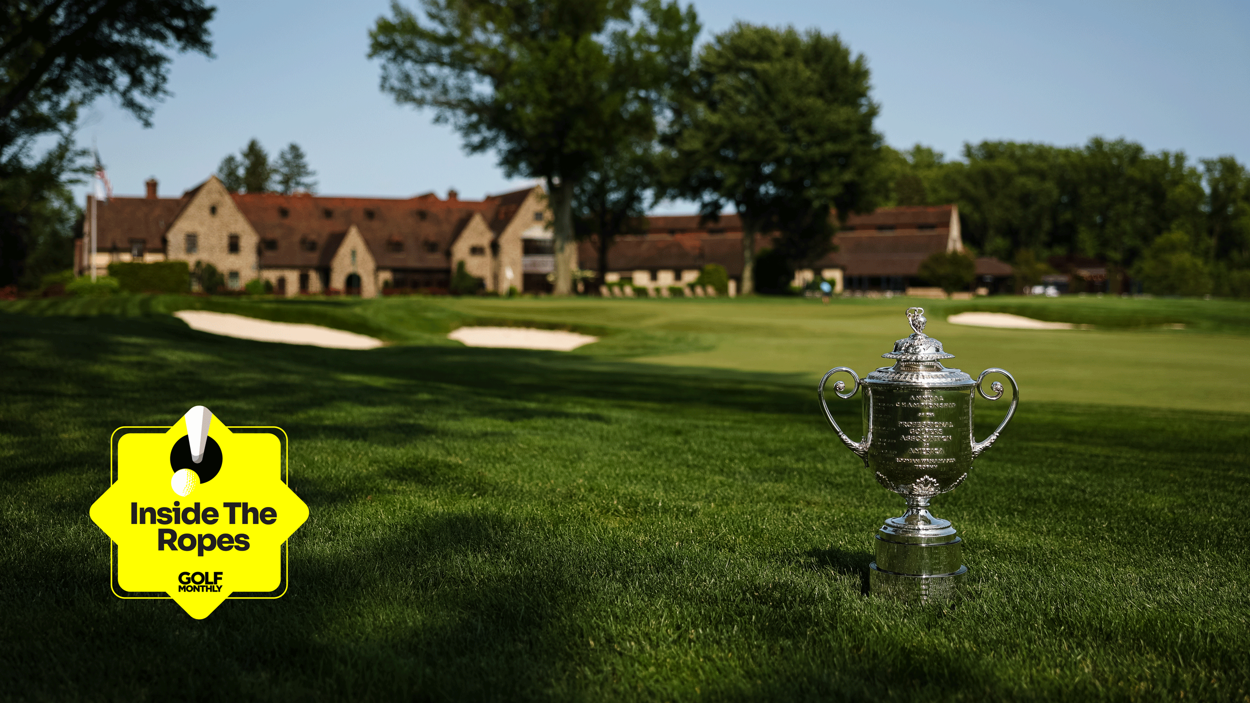 A general view of the Wanamaker Trophy in the foreground and Aronimink Golf Club's clubhouse in the background with the Inside The Ropes sticker in the bottom left