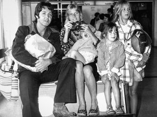Paul and Linda McCartney with their children James, Mary and Stella. London Airport, September 1974