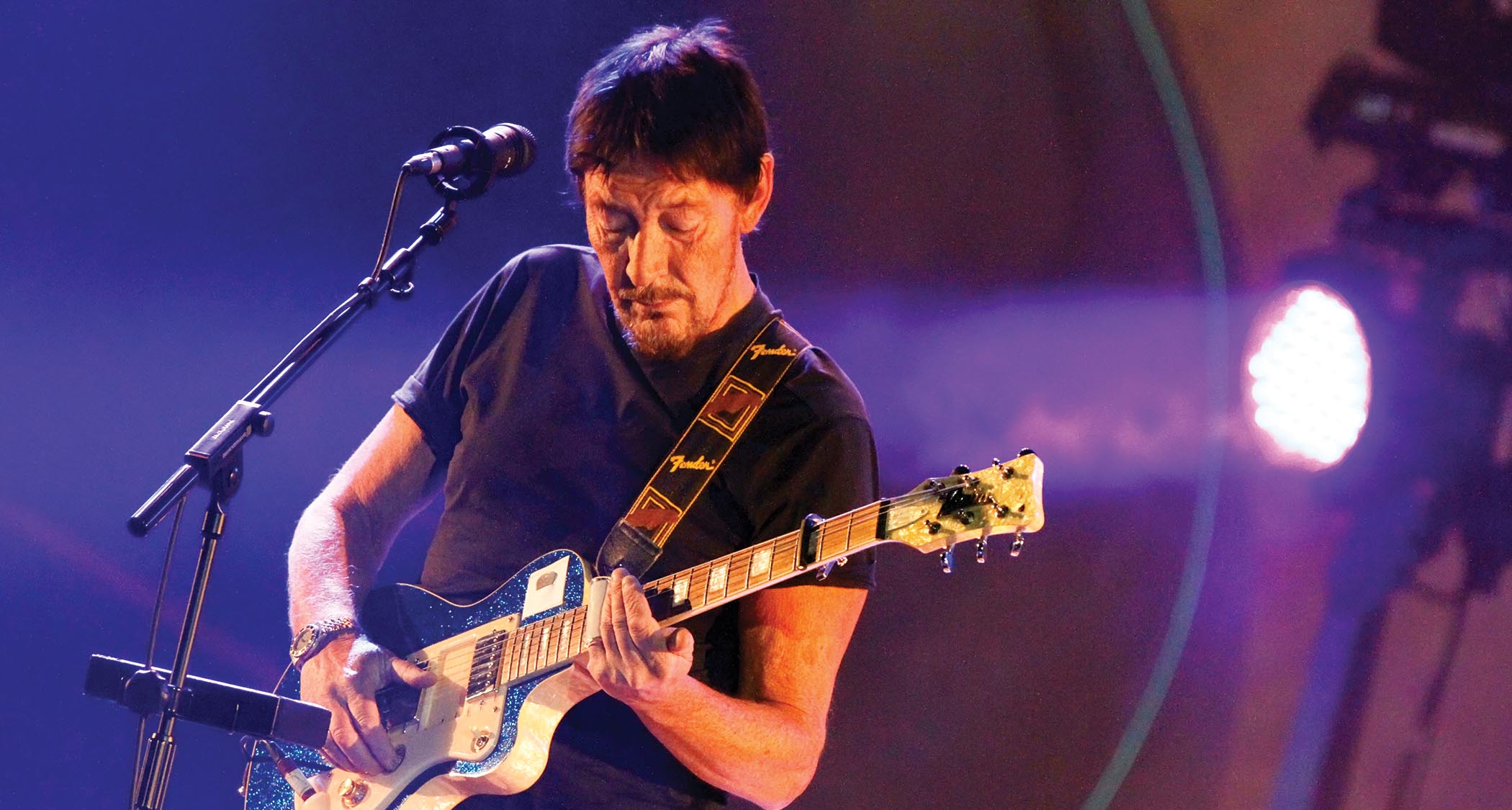 The late Chris Rea plays slide on a capoed electric guitar