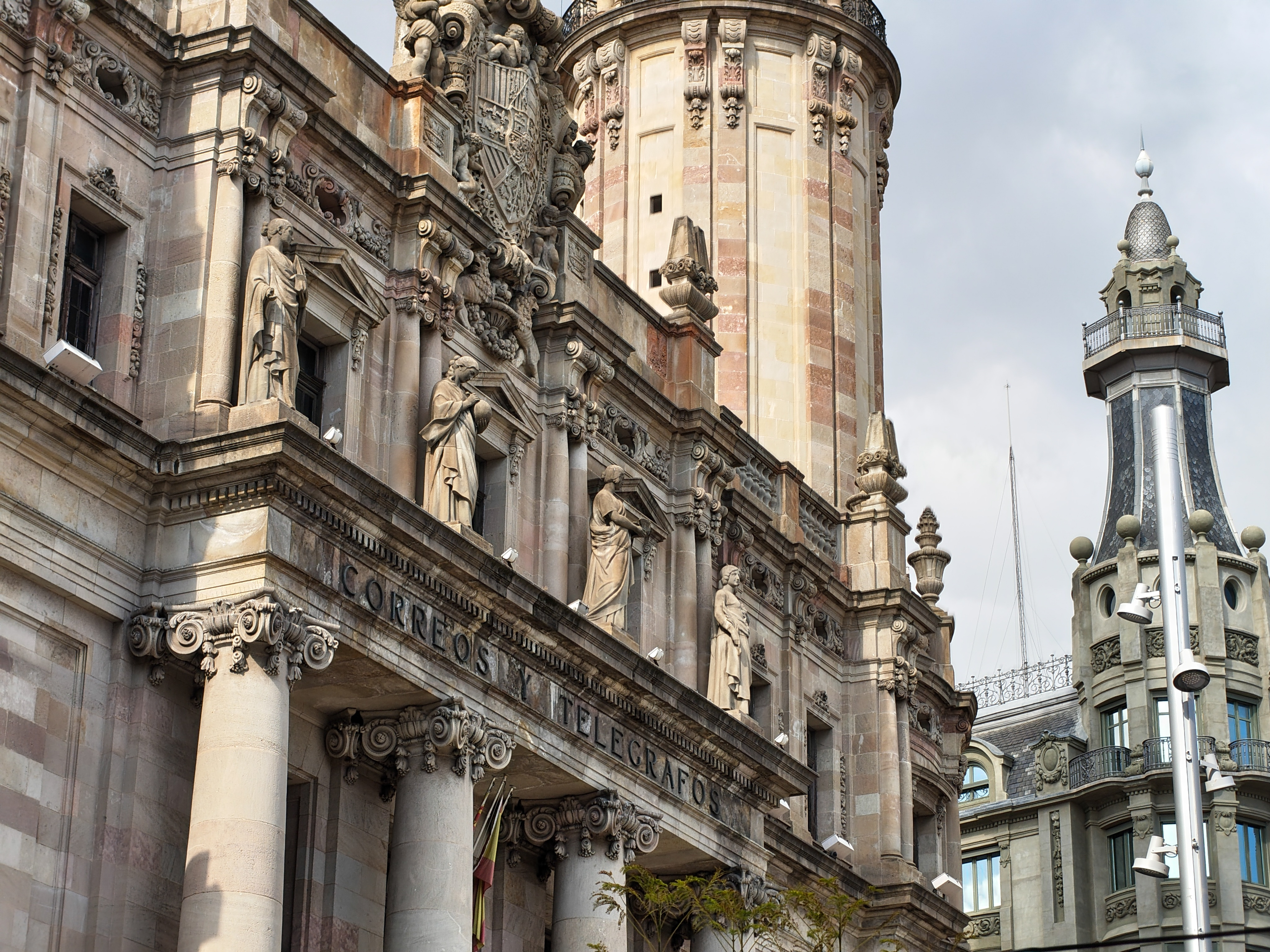 Ornate historic building facade with statues and columns in Barcelona, captured with the Nothing Phone (4a).