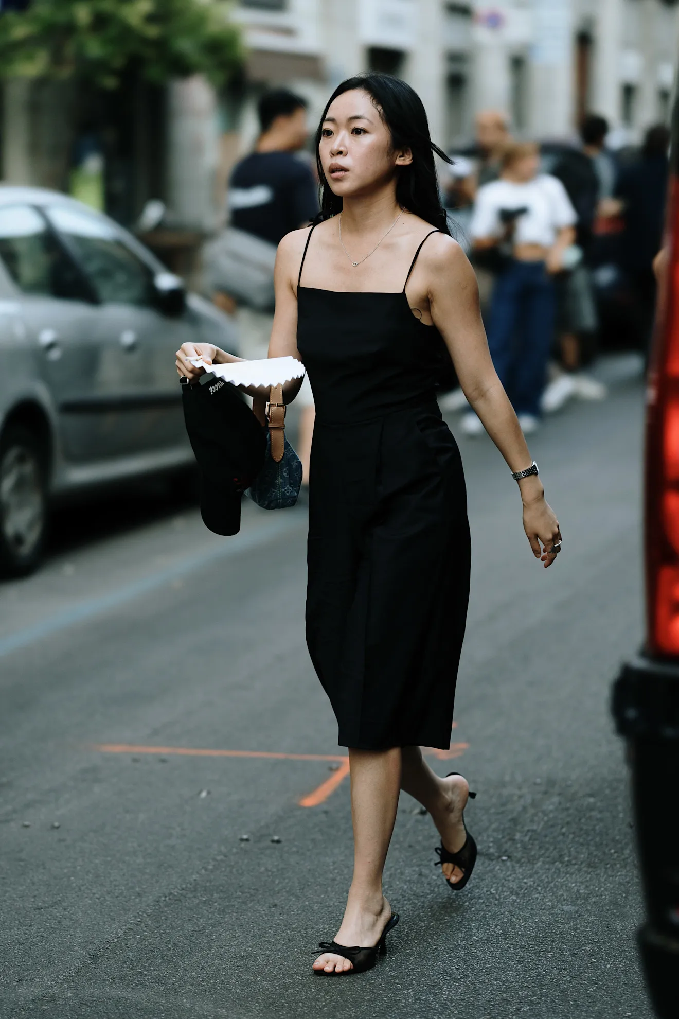 woman wearing a black linen dress