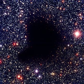 This image from NASA shows a cloud in space (Molecular Cloud Barnard 68, to be precise) that looks a bit like a void, but isn't one. Real voids don't look like much of anything from Earth... because they aren't much of anything.