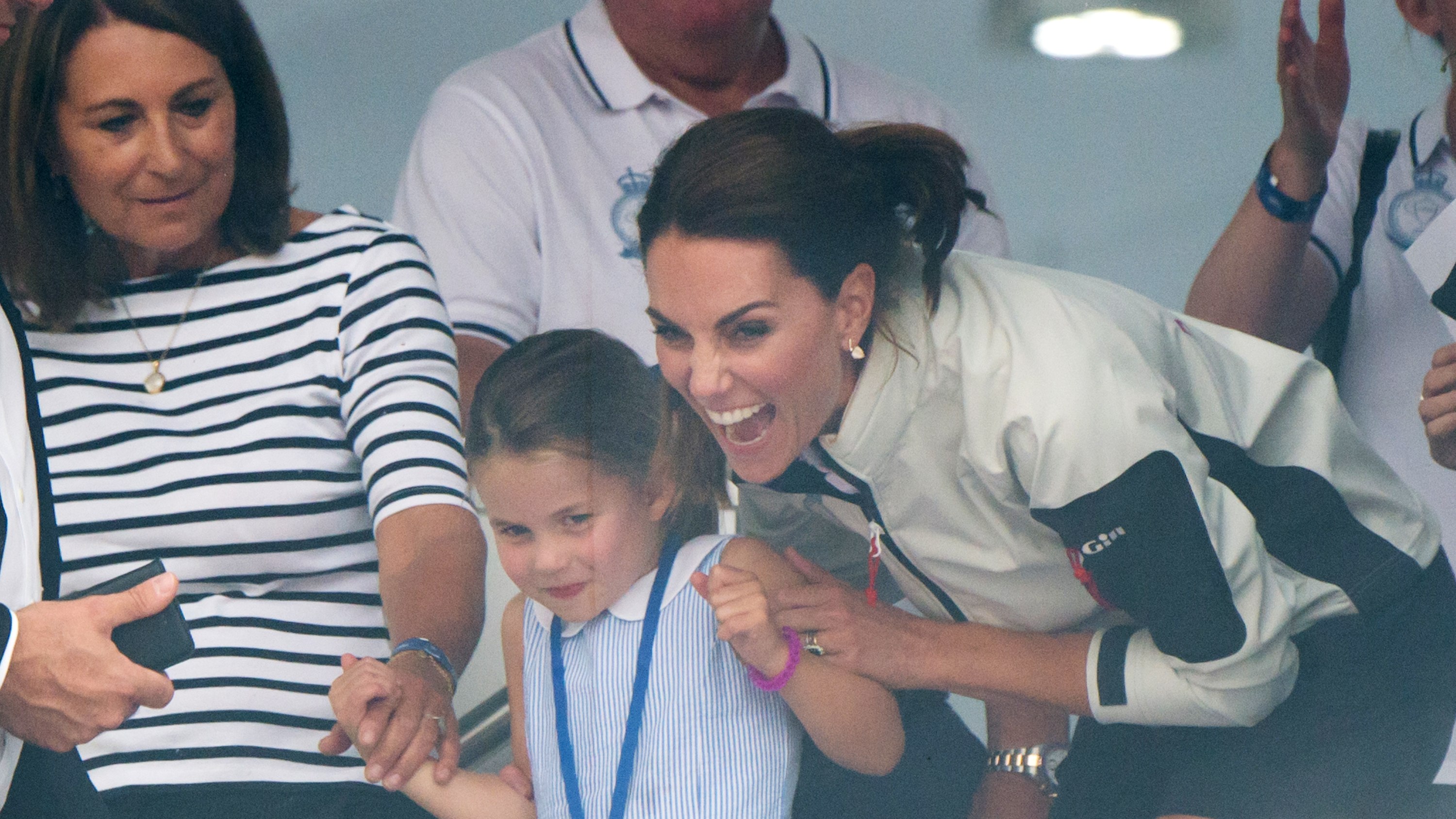 Carole Middleton, Princess Charlotte and Catherine, Princess of Wales excitedly watch the presentation following the King's Cup Regatta on August 08, 2019