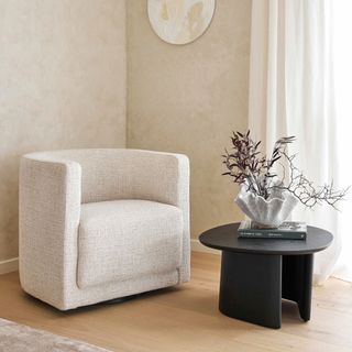 King Living Oliver Tub Chair in cream in a minimalist living room