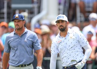 Matthieu Pavon walks alongside Bryson DeChambeau during the US Open