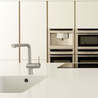 kitchen with marble worktop and sink with tap