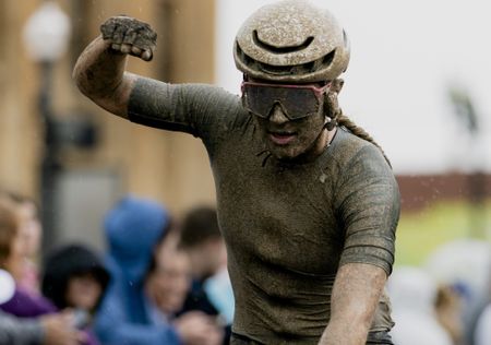Kylee Hanel celebrates winning Unbound Gravel 100 on a wet and muddy day in Kansas in 2026, taking top points in the women's U23 competition