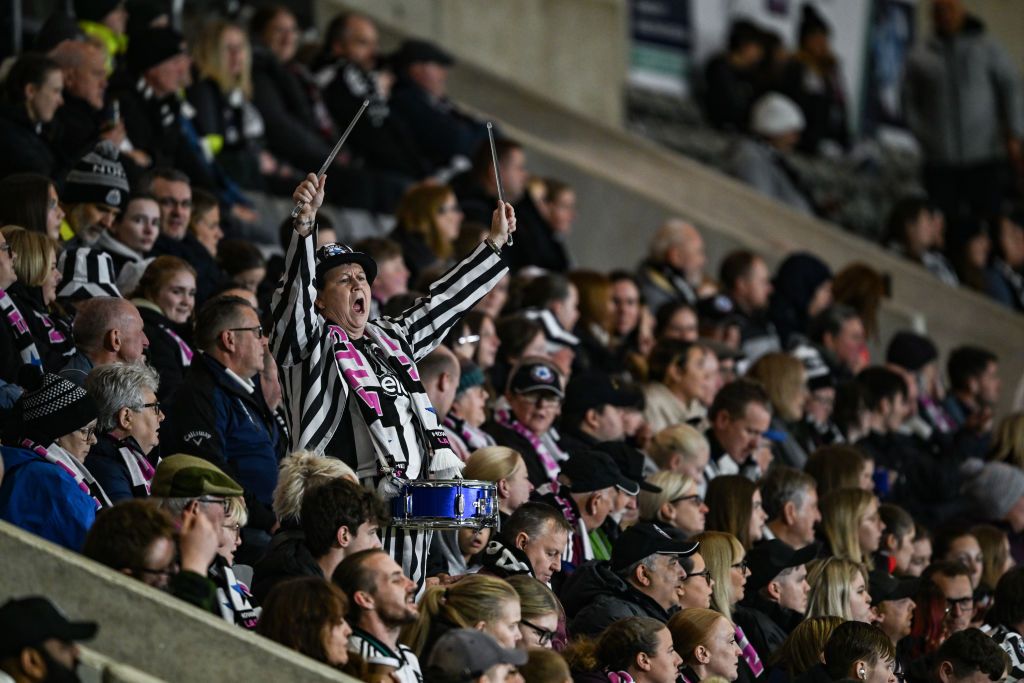 Bernie, a Newcastle United Women&#039;s fan plays her drum in the crowd during the FA WSL Cup between Newcastle United Women and Everton Women at Kingston Park on October 02, 2024 in Newcastle upon Tyne, England.