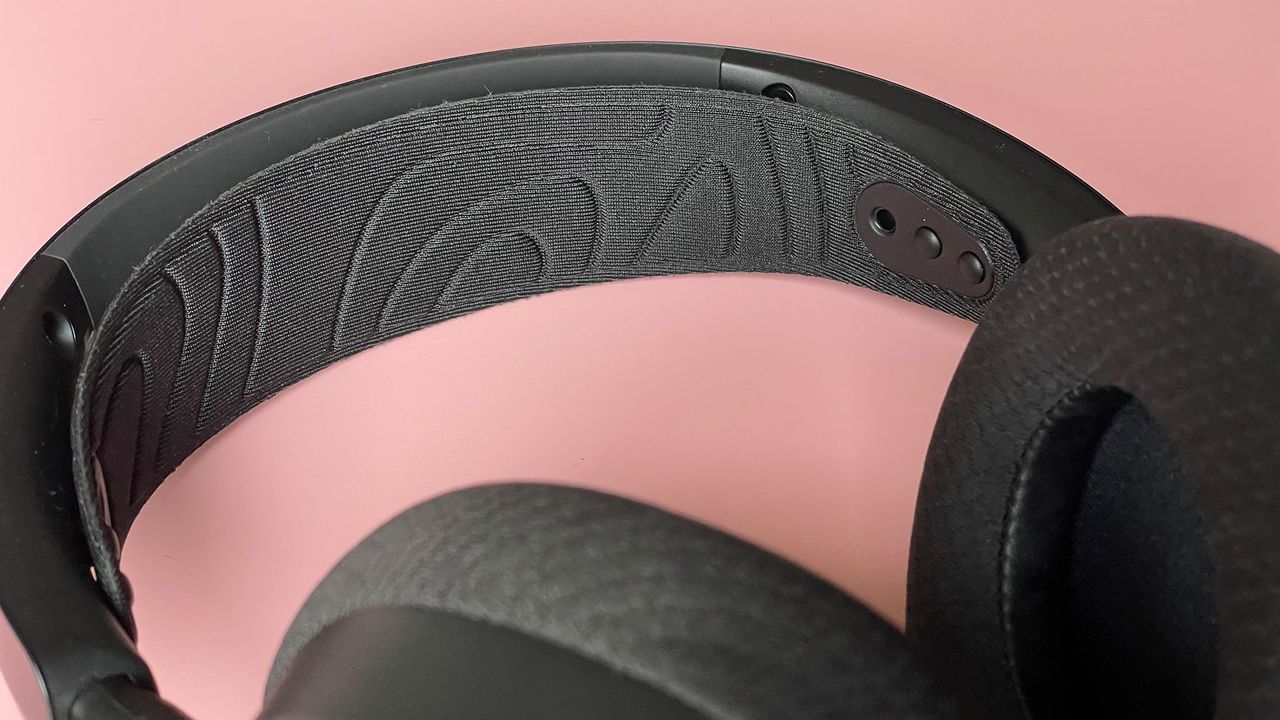 The SteelSeries Arctis Nova 7 Wireless on a pink background.