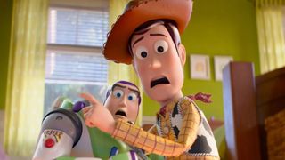 Buzz and Woody cower together in fear