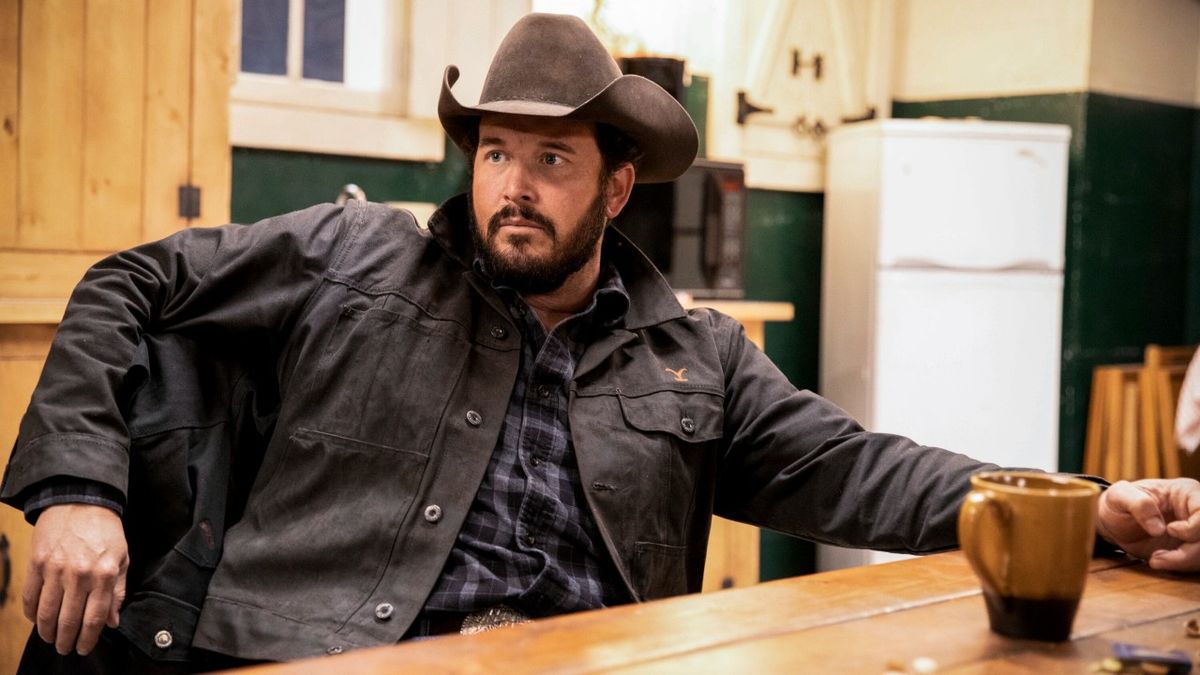 Cole Hauser as Rip Wheeler sitting next to a coffee cup in Season 2 of Yellowstone.