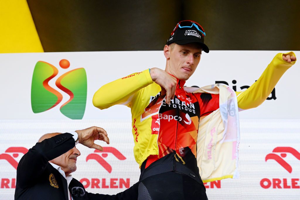 BIELSKOBIALA POLAND AUGUST 02 Matej Mohori of Slovenia and Team Bahrain Victorious celebrates at podium as Yellow leader jersey winner during the 80th Tour de Pologne 2023 Stage 5 a 1988km stage from Pszczyna to BielskoBiala 430m UCIWT on August 02 2023 in BielskoBiala Poland Photo by Dario BelingheriGetty Images