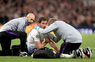 Tottenham Hotspur’s Jan Vertonghen is treated for the injury