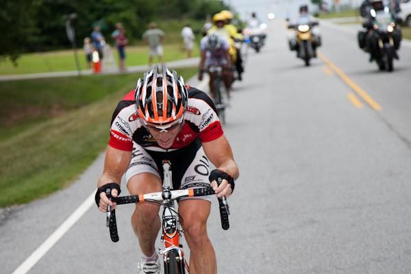 Brad White (OUCH) goes aero as he chases after the lead group.