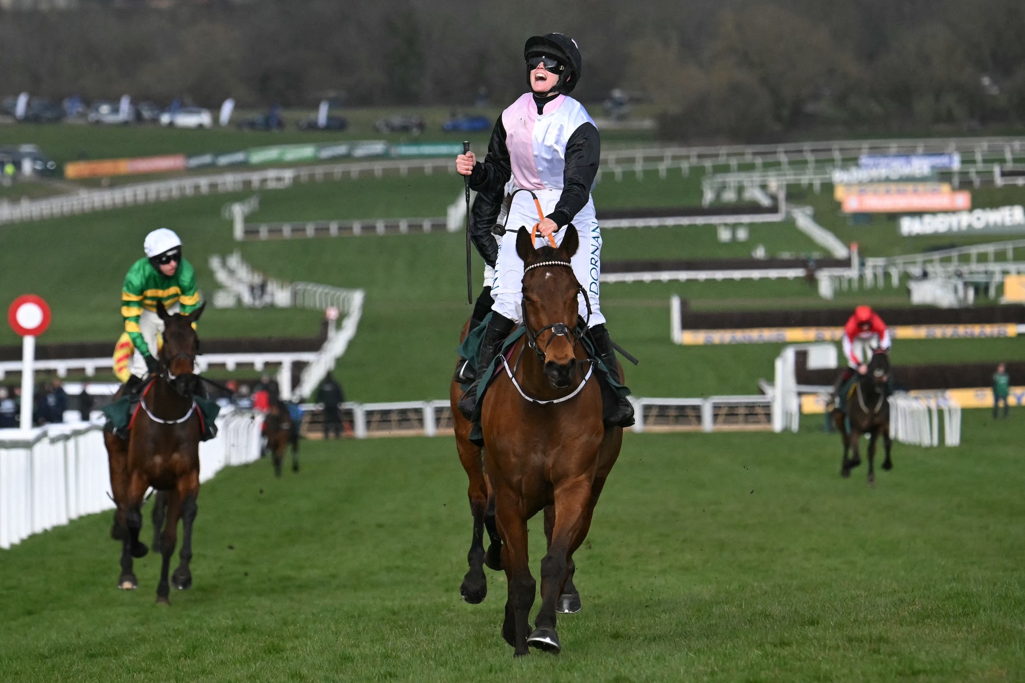 Jockey Rachael Blackmore celebrates after the victory of Bob Olinger in the Stayer's Hurdle on the third day of the Cheltenham Festival at Cheltenham Racecourse, in Cheltenham, western England on March 13, 2025. (Photo by JUSTIN TALLIS / AFP)