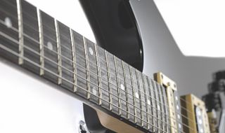 The fretboard of a Dean DBD Tribute ML guitar