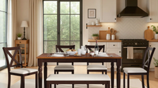 a dining table with four chairs and a bench in a kitchen 