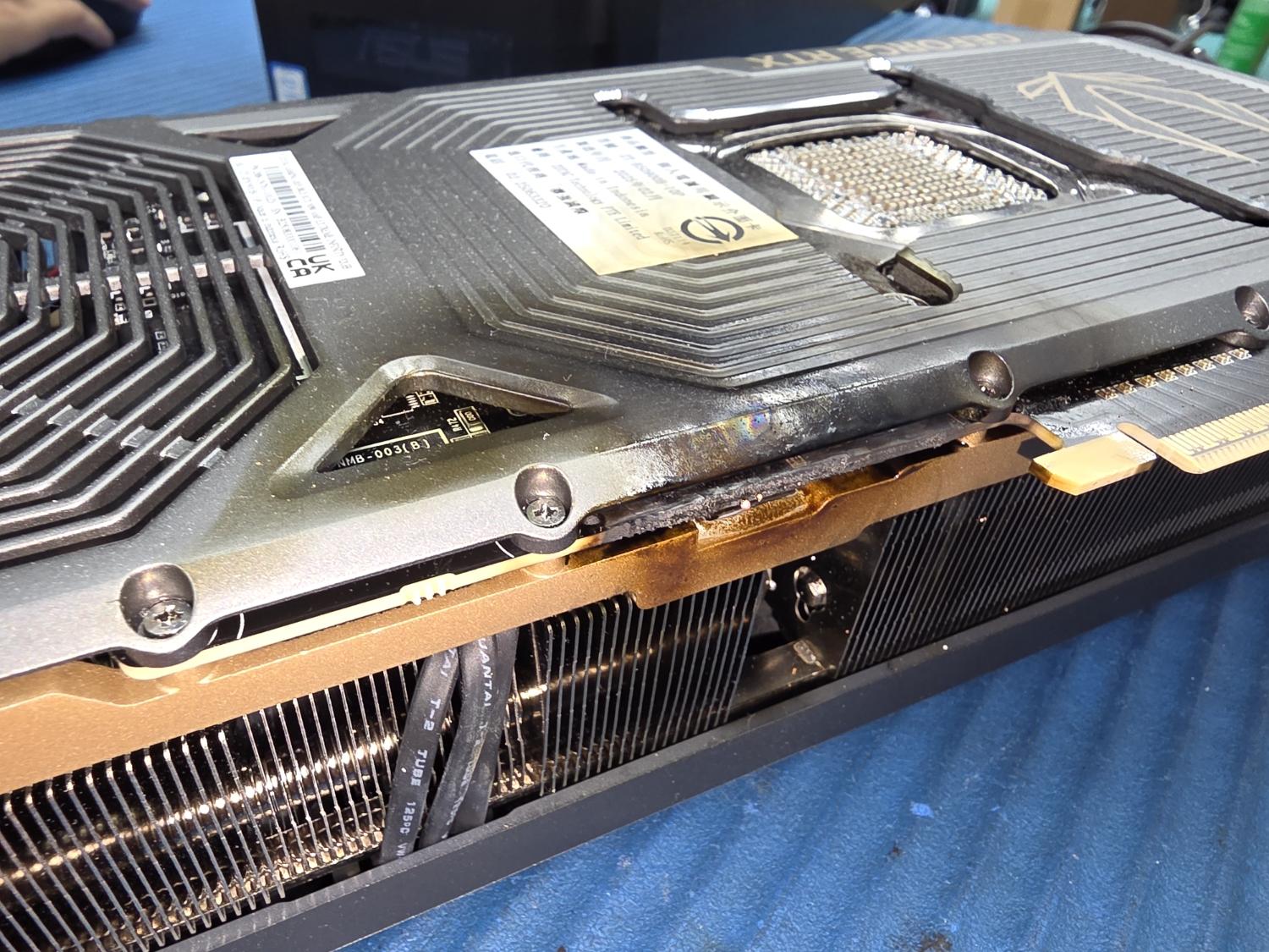 An RTX 5090 that caught fire and also left burnt marks on the motherboard, AIO cooler and RAM