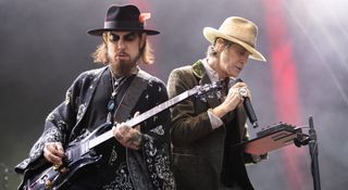 Dave Navarro takes a solo on his PRS with Perry Farrell by his side; the Jane's Addiction reunion fell apart on 13 September when Farrell assaulted Navarro onstage.