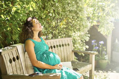 A pregnant woman in the sun, as you can sunbathe when pregnant