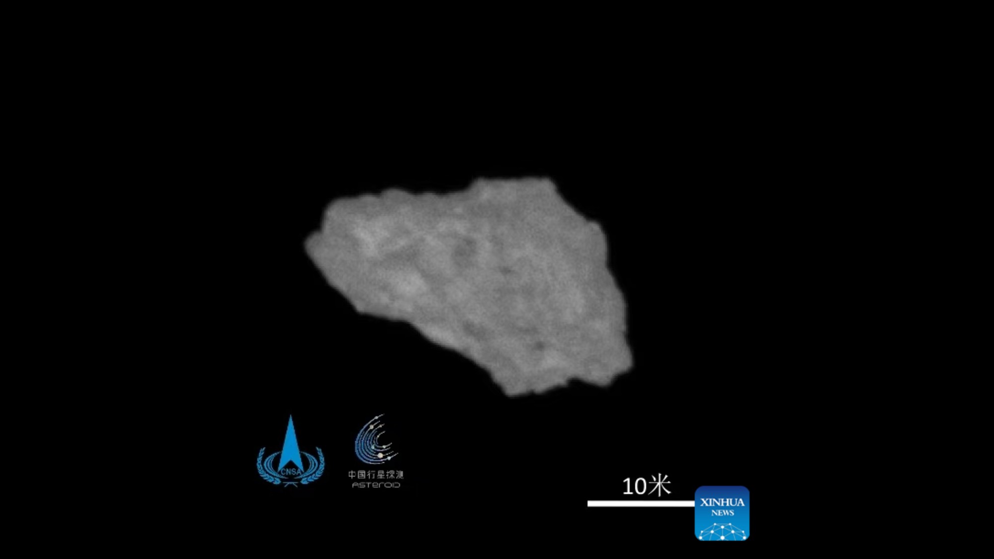 a grey, jagged rock on a black background