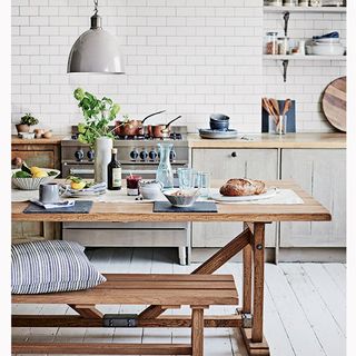 kitchen room with white tiled walls and white wooden flooring