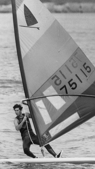 A young King Charles windsurfing