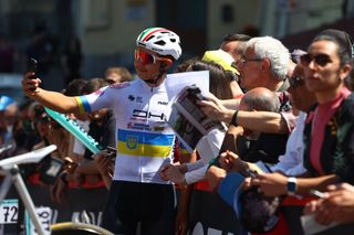 Andrii Ponomar takes a selfie with fans at the Giro d'Italia 2022