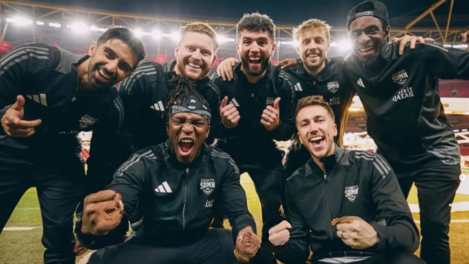 an image of the sidemen in their match game tracksuits posing on the pitch