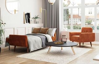 An orange velvet sofa bed in a modern living room