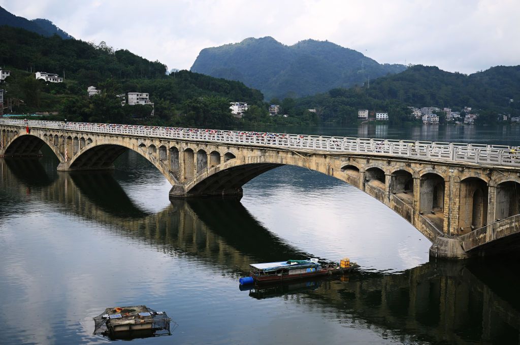 JINCHENGJIANG CHINA OCTOBER 18 A general view of the peloton passing through a landscape during the 5th GreeTour Of Guangxi 2024 Stage 3 a 1768km stage from Bama to Jinchengjiang UCIWT on October 18 2024 in Jinchengjiang China Photo by Dario BelingheriGetty Images