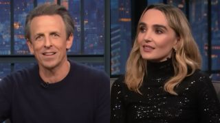 Left to right: Sether Myers looking into the camer and Chloe Fineman looking to her left on Late Night with Seth Meyers.