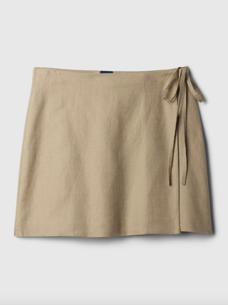a linen wrap skirt on a plain backdrop