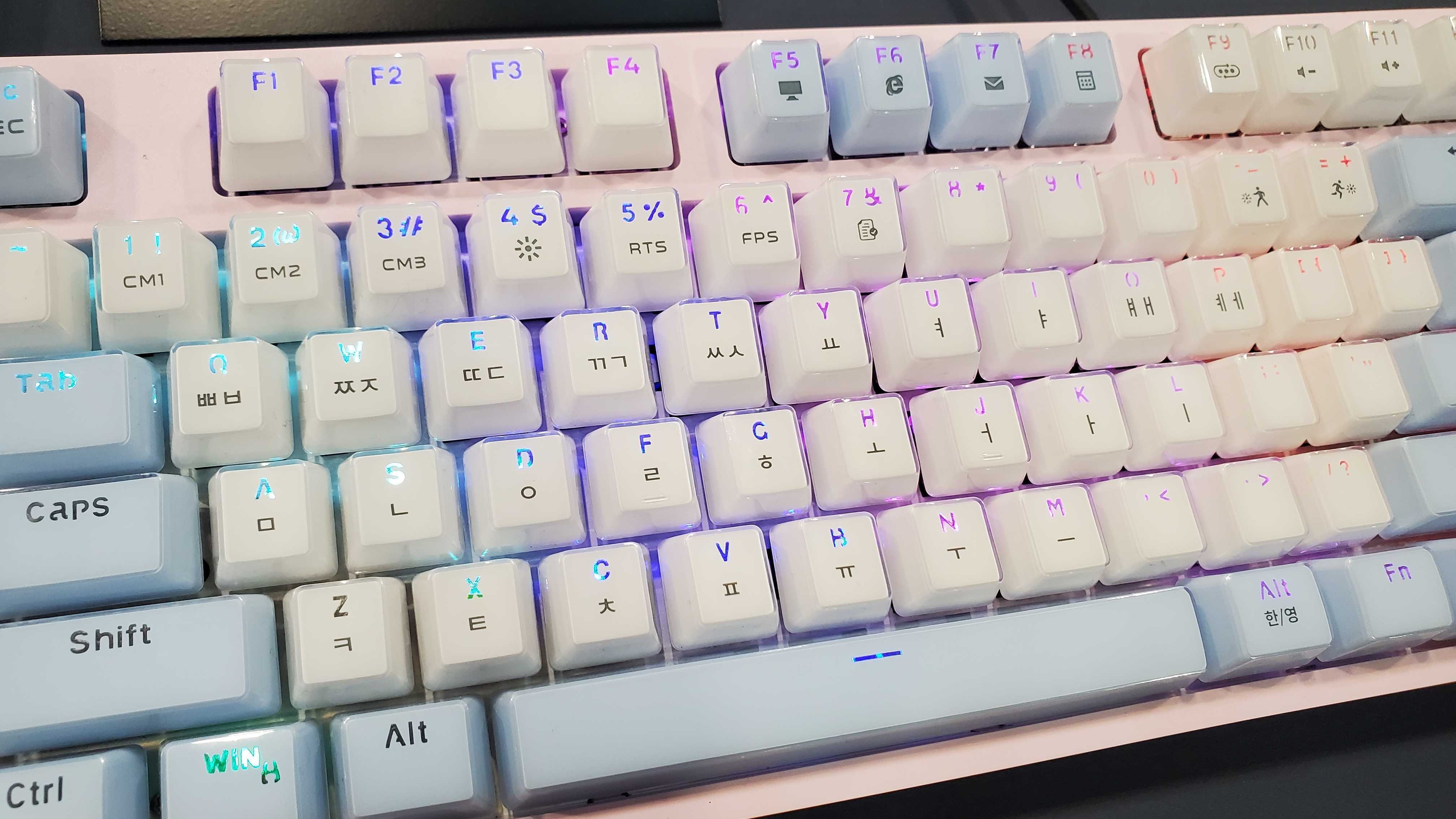 pink and blue keyboard with backlight