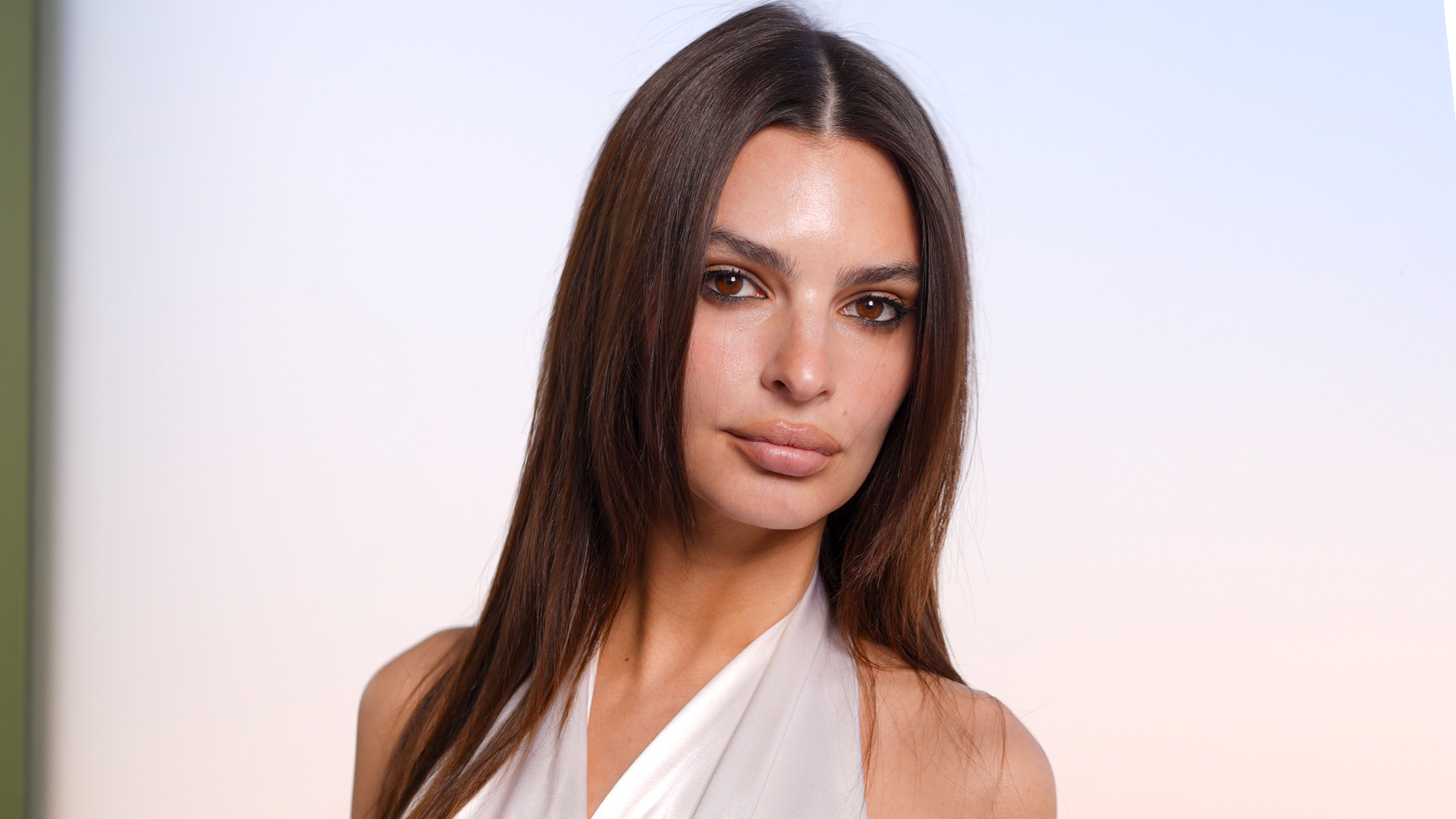 Emily Ratajkowski attended her first Dior show since 2017 in a white tunic and pleated black trousers