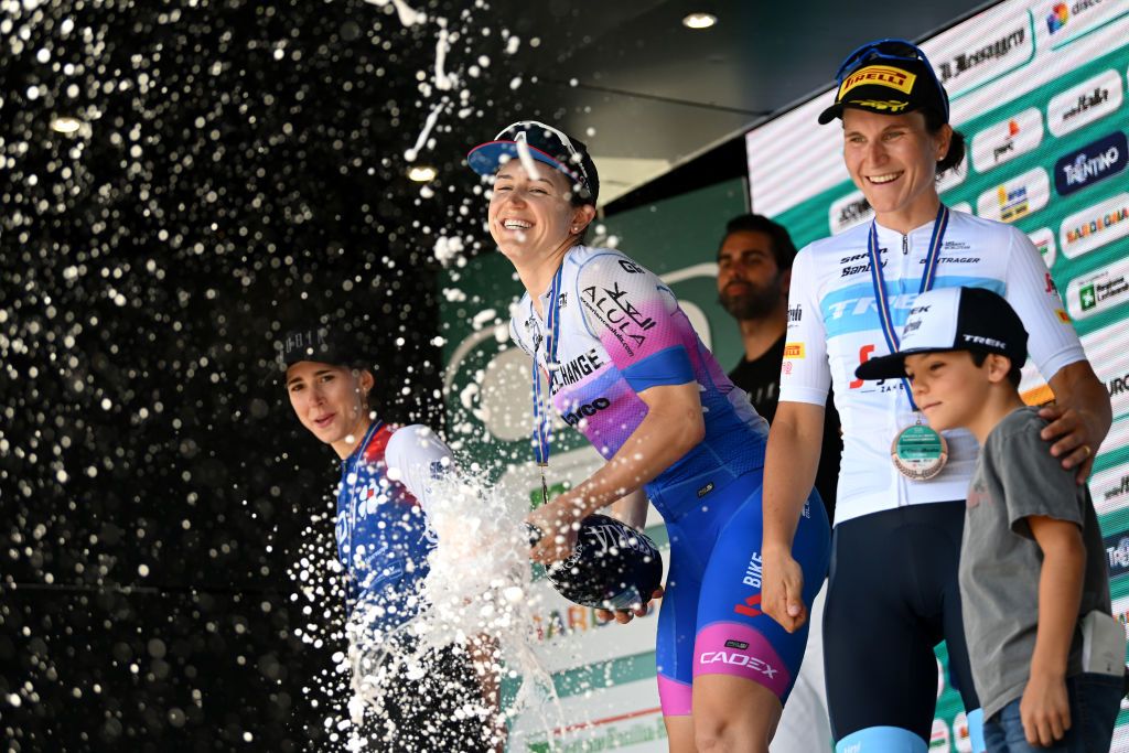 SAN LORENZO DORSINO ITALY JULY 09 LR Marta Cavalli of Italy and Team FDJ Nouvelle Aquitaine Futuroscope on second place stage winner Kristen Faulkner of United States and Team BikeExchange Jayco and Elisa Longo Borghini of Italy and Team Trek Segafredo on third place pose and celebrate with champagne on the podium ceremony after the 33rd Giro dItalia Donne 2022 Stage 9 a 1128km stage from San Michele AllAdige to San Lorenzo Dorsino 727m GiroDonne UCIWWT on July 09 2022 in San Lorenzo Dorsino Italy Photo by Dario BelingheriGetty Images