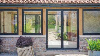 a close up of a house with aluminium windows and patio doors