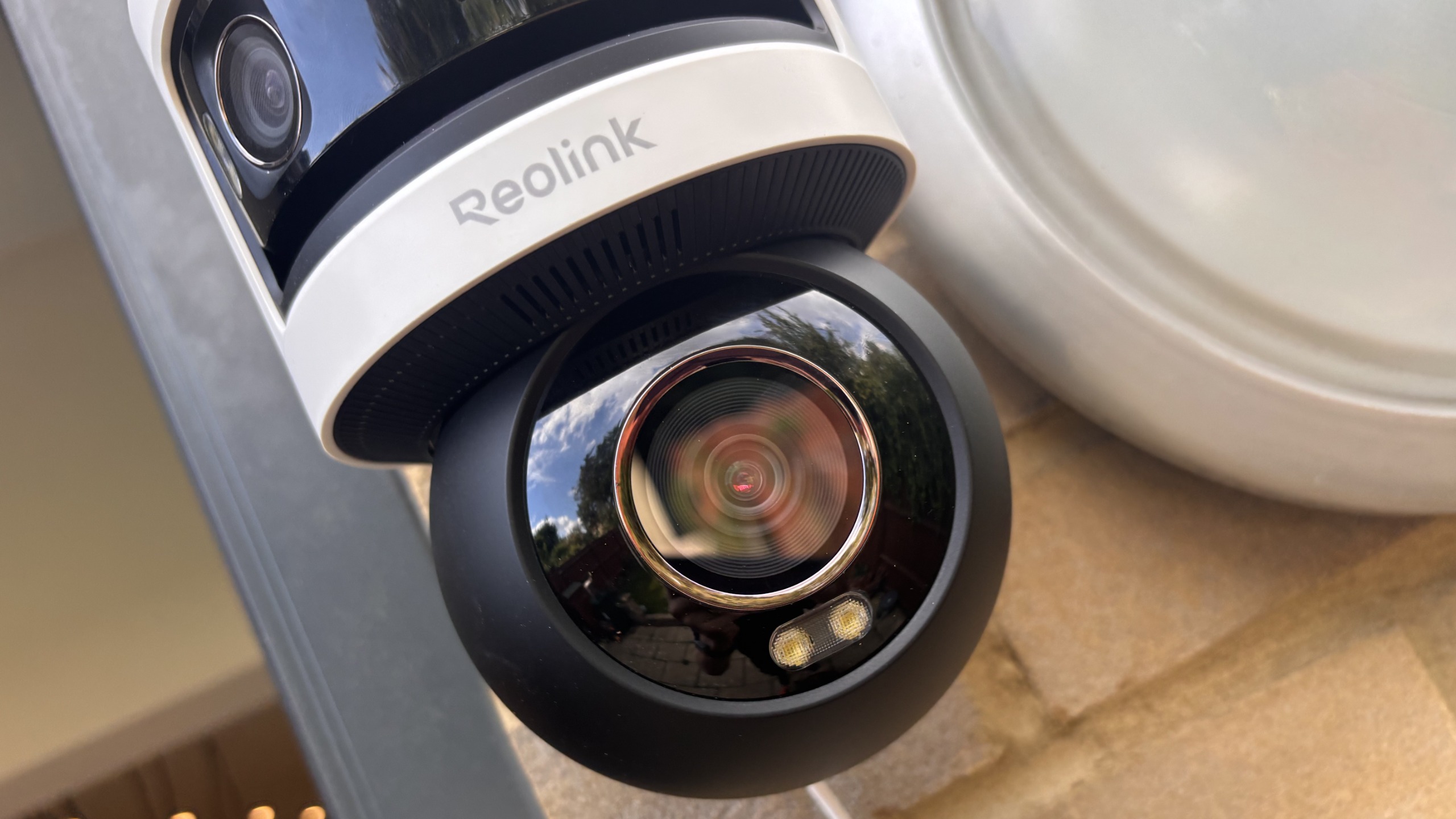 Reolink Omvi 3i security camera installed outside home