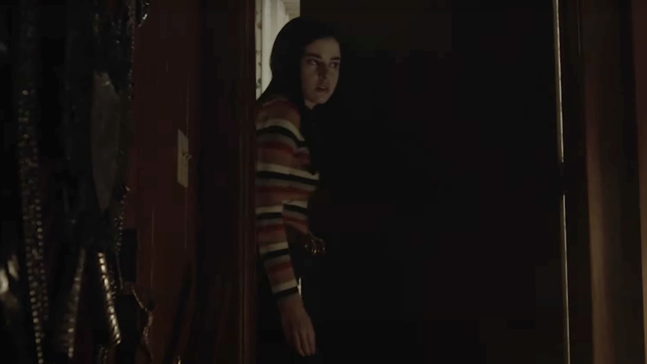 Katie Sarife as Daniela entering the Warrens' artifact room in Annabelle Comes Home