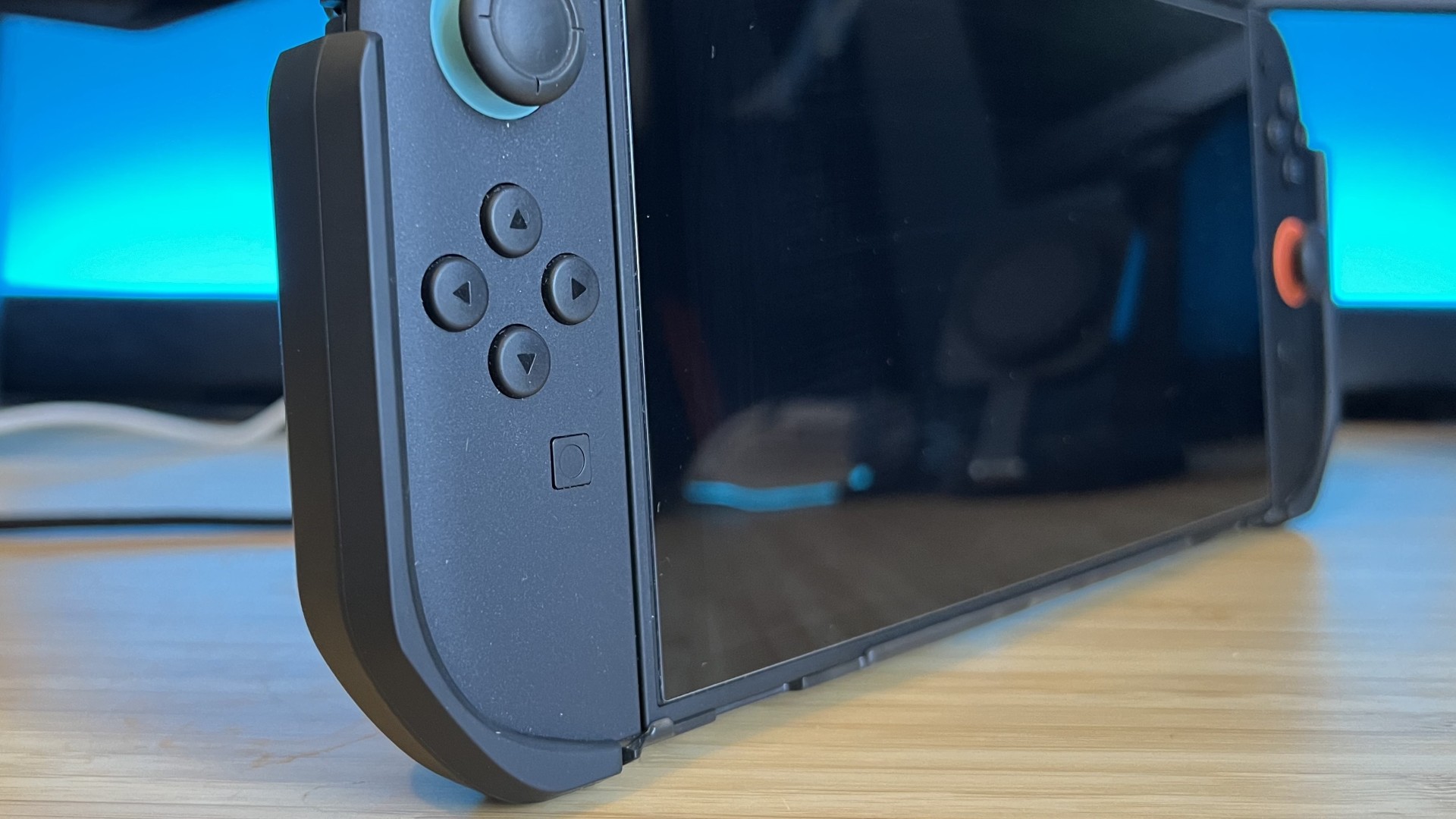 Corner of Nintendo Switch 2 with SupCase Unicorn Beetle Pro case attached, showing depth of bumpers around the Joy-Con