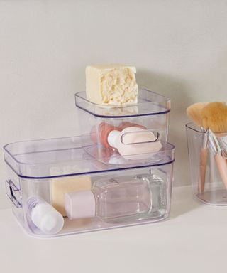 Clear bathroom storage containers from Orthex on shelf