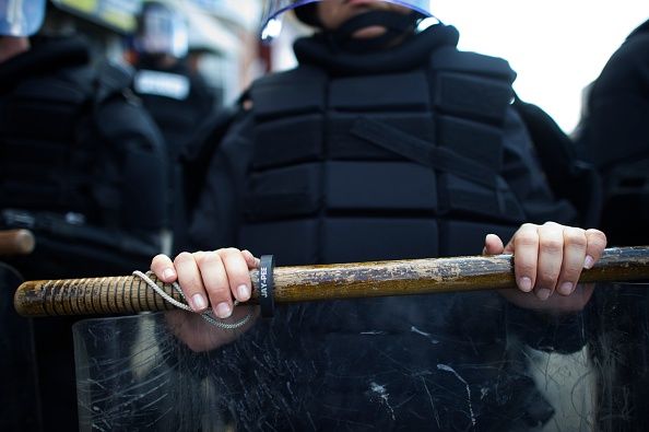 A police officer in riot gear