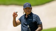 Anthony Kim holds his ball up in acknowledgement to the crowd during the 2025 LIV Golf season