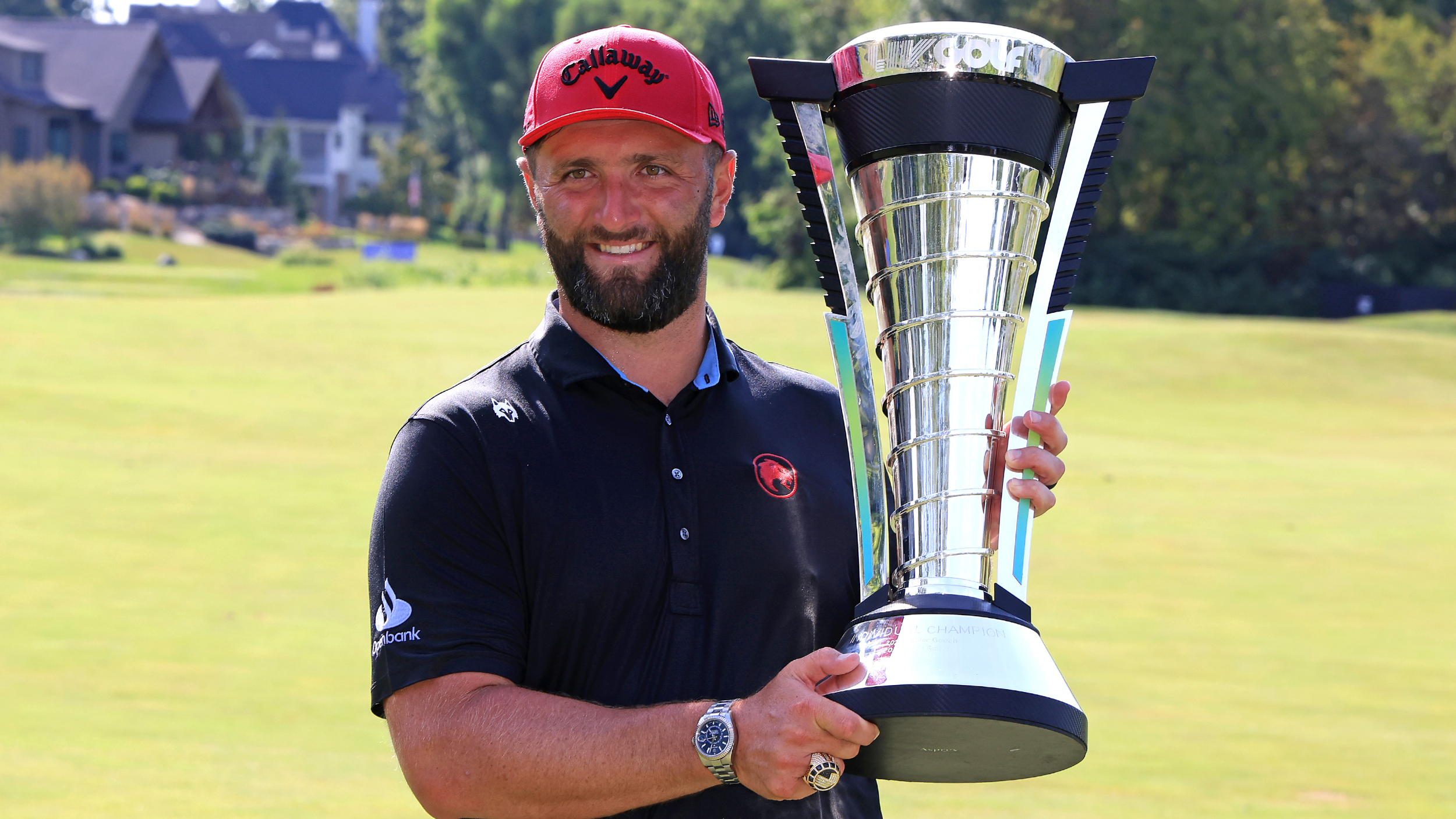 Jon Rahm with the Individual Championship trophy 