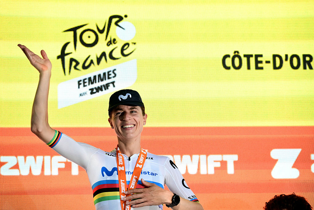 Movistar Team's Swiss rider Marlen Reusser celebrates on the podium after winning the individual time-trial in the 4th (out of 9) stage of the fifth edition of the Women's Tour de France cycling race, 21 km time trial between Gevrey-Chambertin and Dijon, in Dijon, eastern France on August 4, 2026. (Photo by NICOLAS TUCAT / AFP)