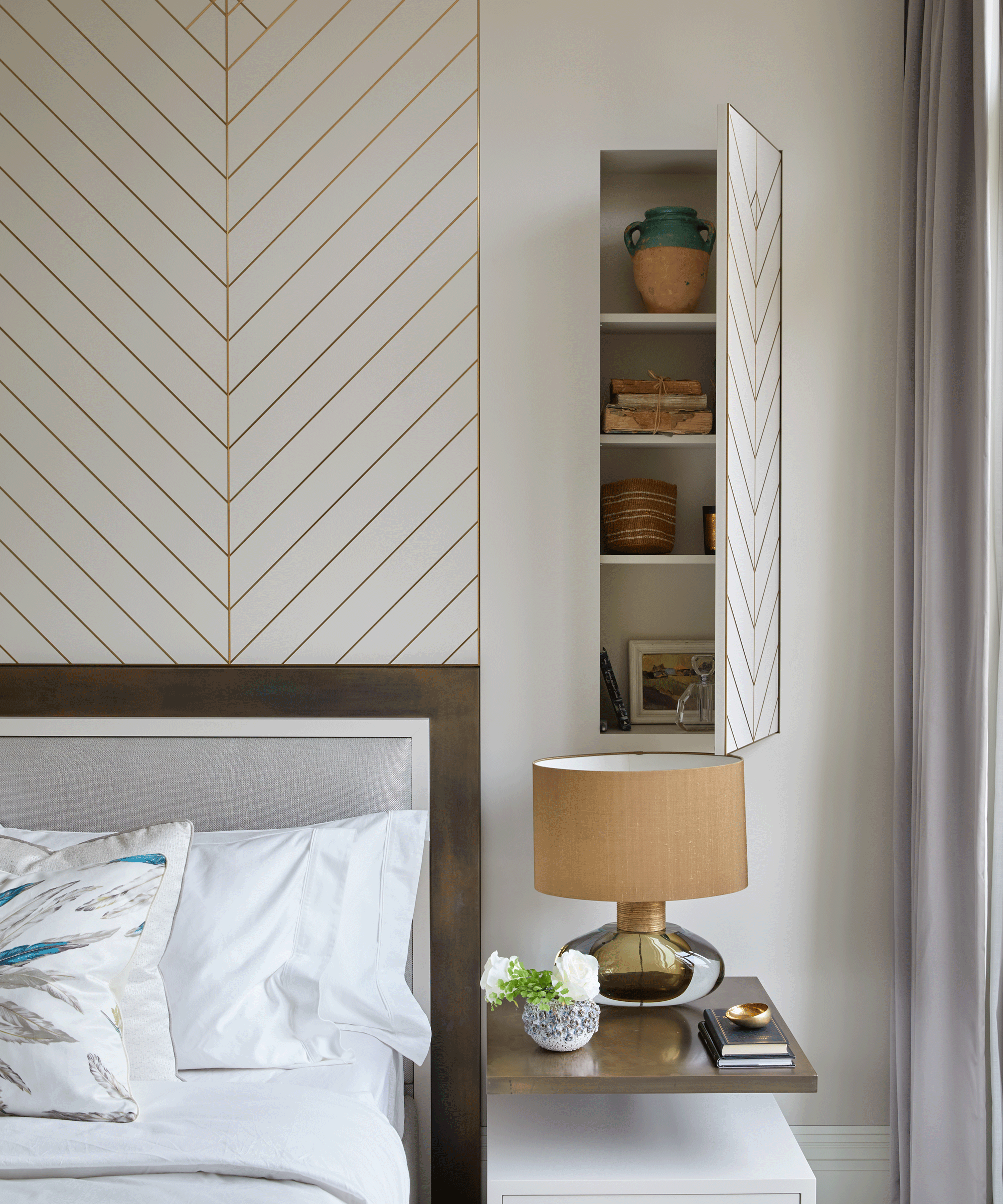 Bedroom with white walls and chevron metallic lines